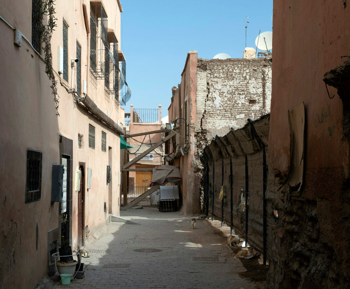 Narrow street between old buildings in a Moroccan medina
