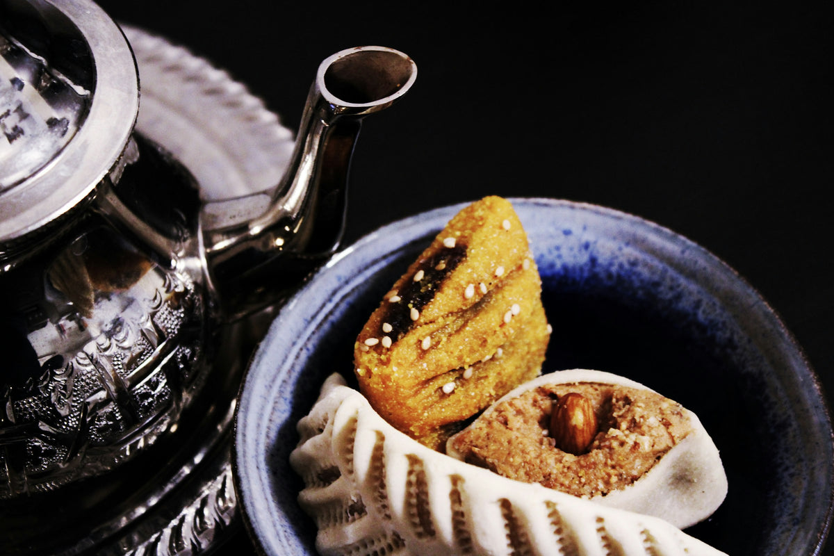 Moroccan pastries beside a teapot